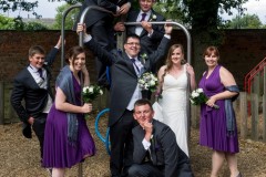 bridal party on play equipment