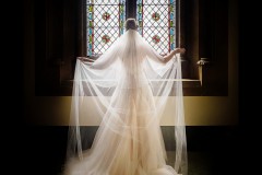 bride holding out her veil