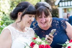 bride looking at mobile phone